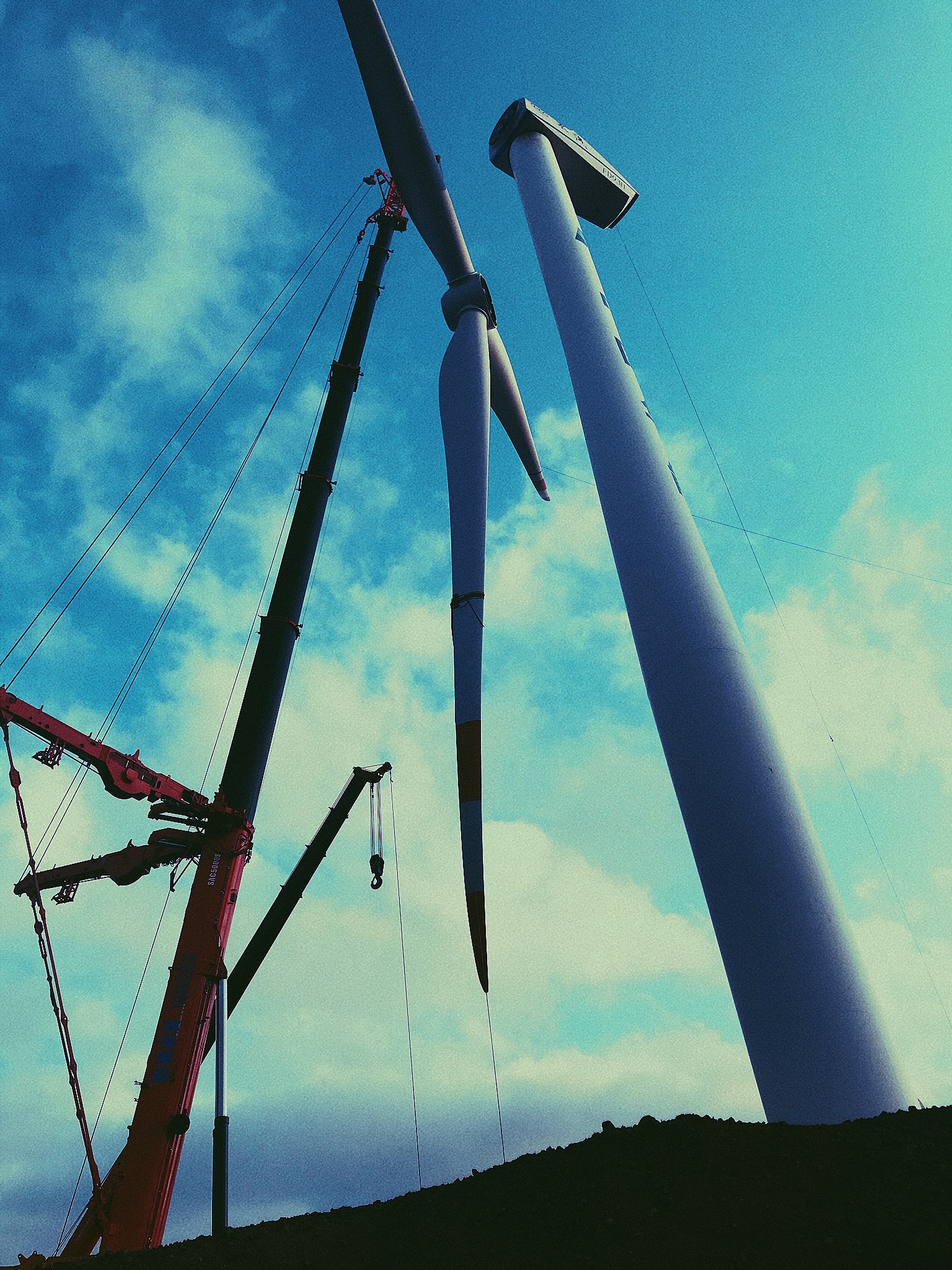 Complete overview of All Terrain Crane Operations featuring certified crane operator executing lift plan with proper hand signals, ground crew coordination, and safety zone establishment per OSHA regulations