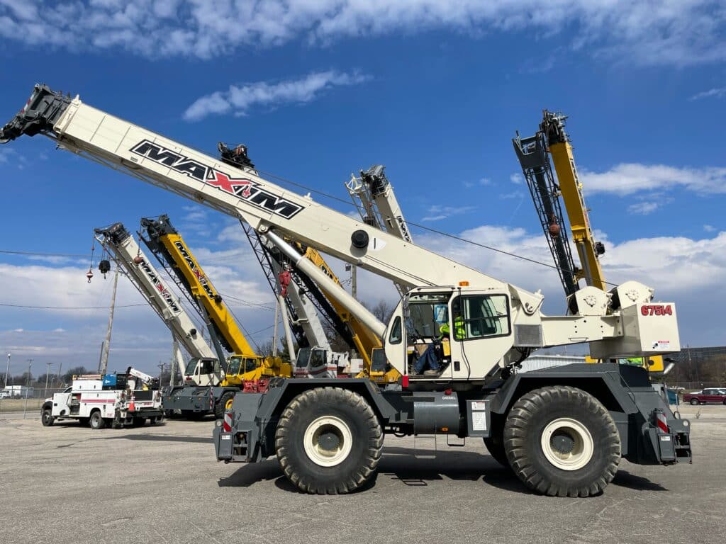 Step-by-step demonstration of All Terrain Crane Operations showing load chart interpretation, boom angle calculations, and outrigger positioning per NCCCO certification requirements and ASME standards