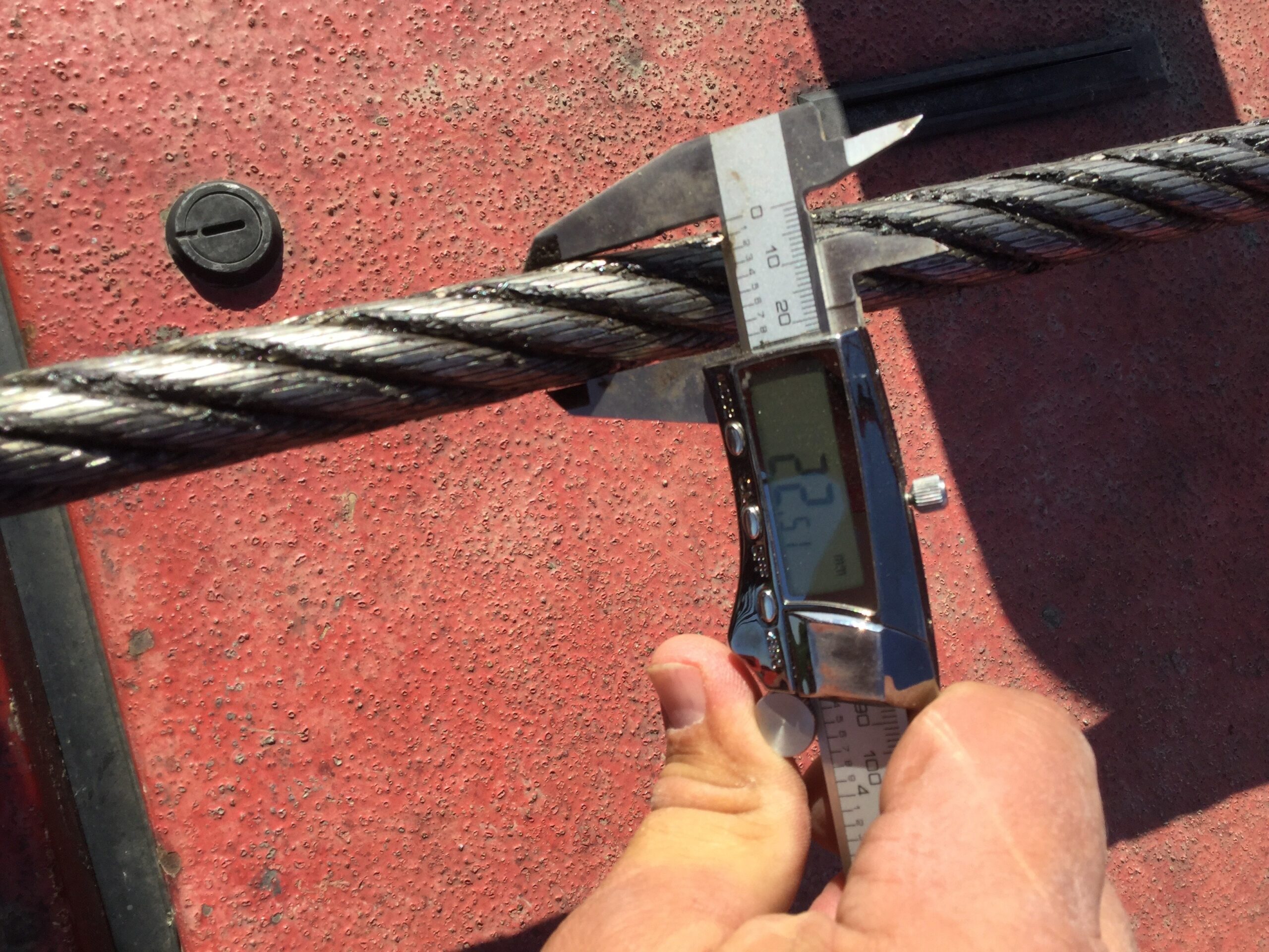 Crane operator performing wire rope inspection procedures during pre-shift inspection - critical skills tested on NCCCO written and practical exams for LAT and TSS certification