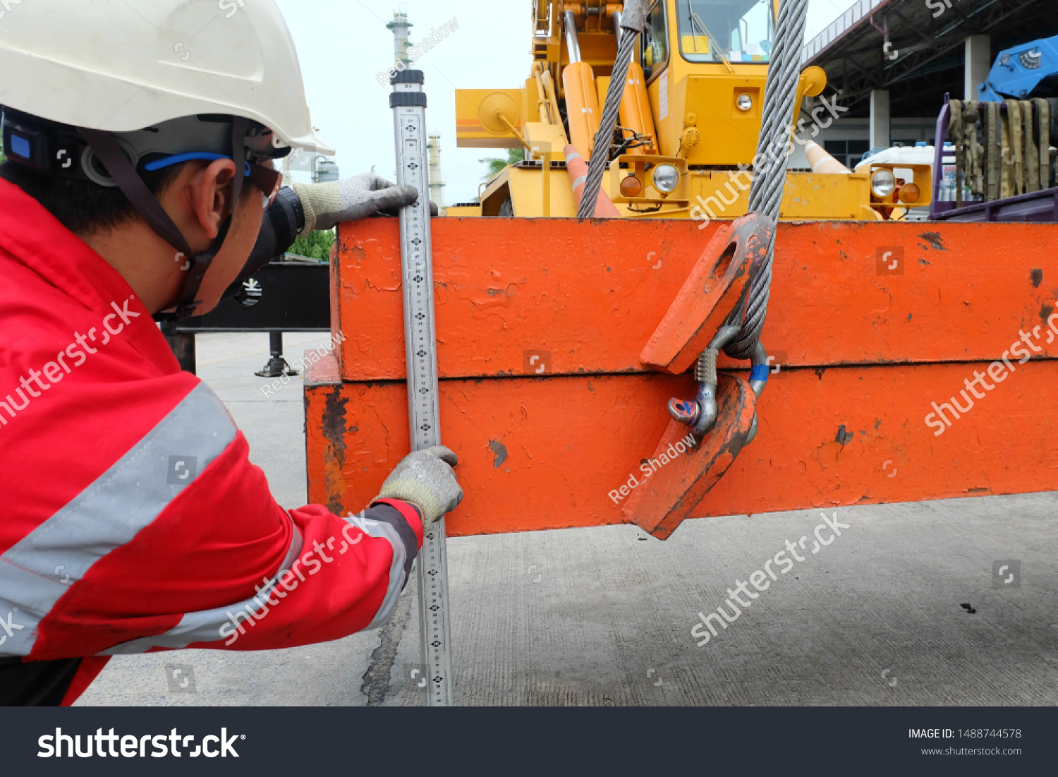 Professional crane operator demonstrating ASME Boom Inspection Requirements techniques on an active construction site - essential knowledge for NCCCO certification exam preparation covering boom inspection safety protocols and operational procedures