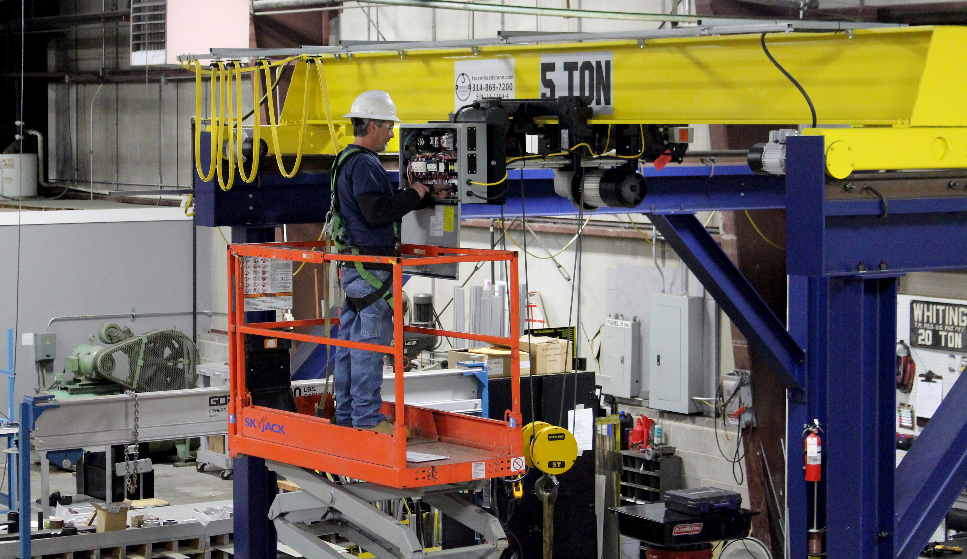 Professional crane operator demonstrating ASME Sheave Inspection Guide techniques on an active construction site - essential knowledge for NCCCO certification exam preparation covering sheave inspection safety protocols and operational procedures