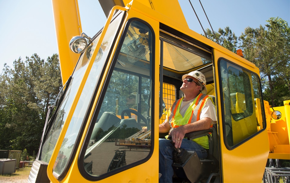 Step-by-step demonstration of Becoming an Independent Crane Operator showing load chart interpretation, boom angle calculations, and outrigger positioning per NCCCO certification requirements and ASME standards