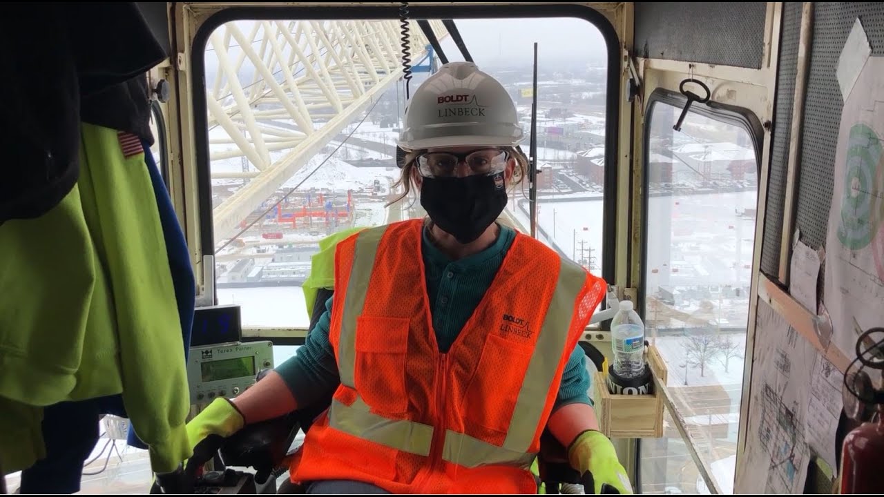 Professional crane operator demonstrating Women in Crane Operations Career Guide techniques on an active construction site - essential knowledge for NCCCO certification exam preparation covering women crane operators safety protocols and operational procedures