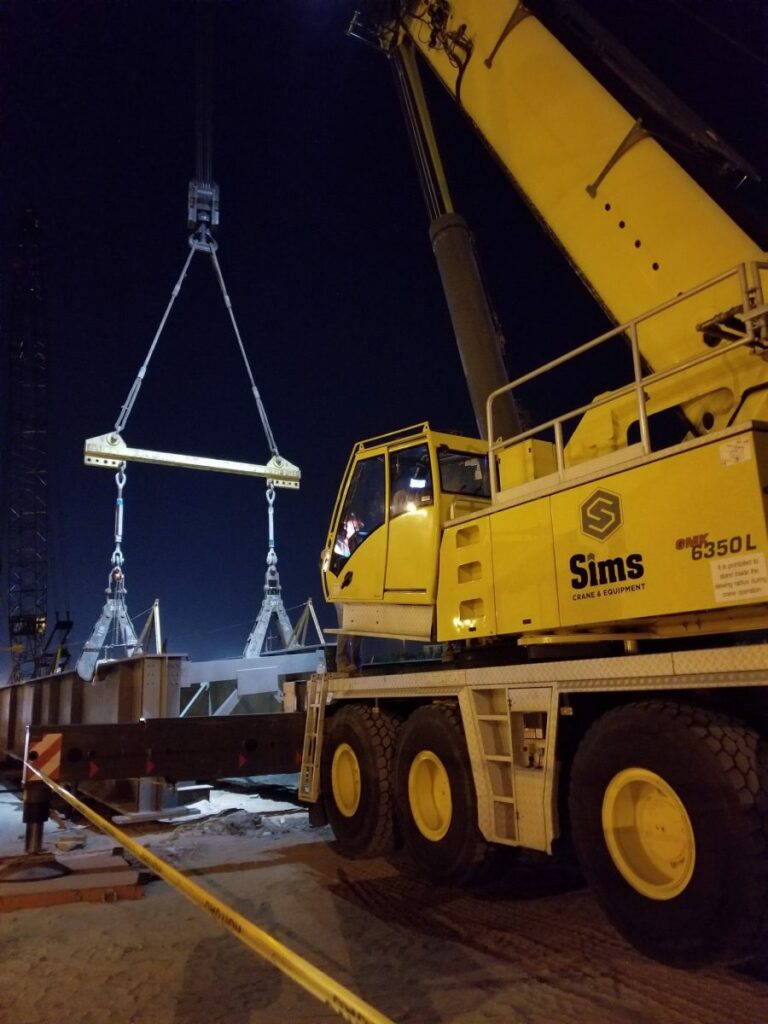 Detailed view of Center of Gravity for Crane Loads implementation showing proper crane setup and rigging configuration as required by OSHA 29 CFR 1926 regulations and ASME B30.5 standards for certified operators