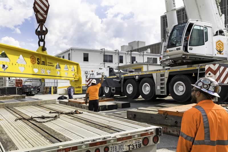 Complete overview of Industrial Site Alert Report: OSHA Compliance Lessons for Crane Operators featuring certified crane operator executing lift plan with proper hand signals, ground crew coordination, and safety zone establishment per OSHA regulations