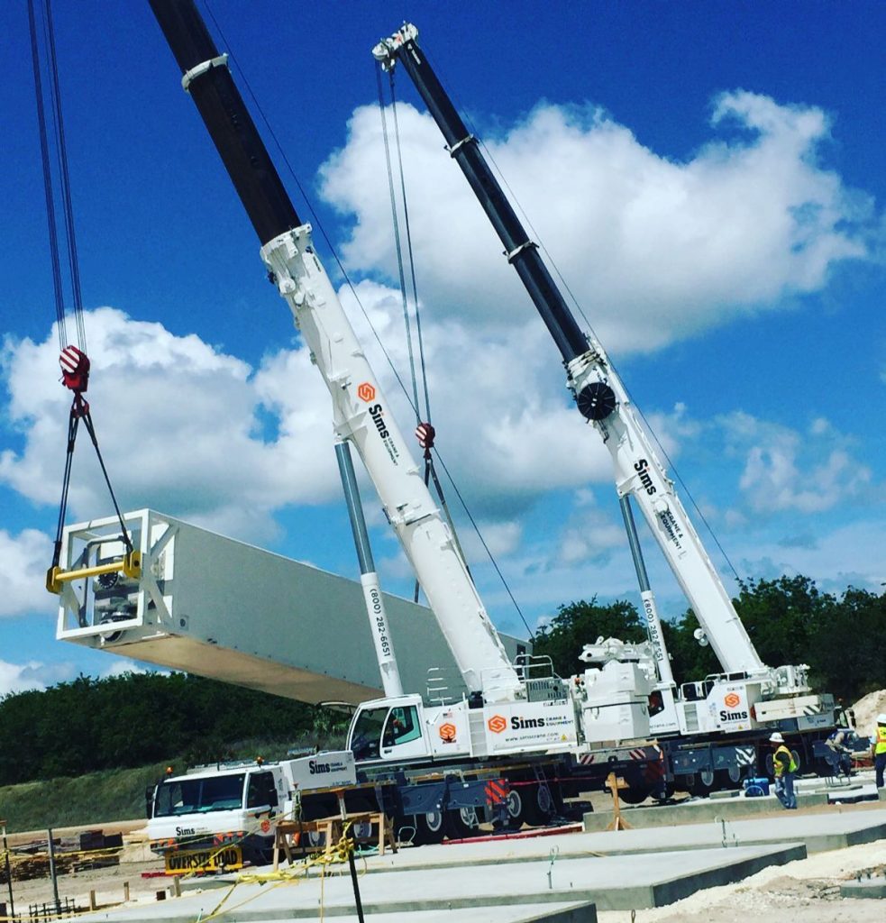 Detailed view of Crane Boom Dolly Transport and Assembly implementation showing proper crane setup and rigging configuration as required by OSHA 29 CFR 1926 regulations and ASME B30.5 standards for certified operators