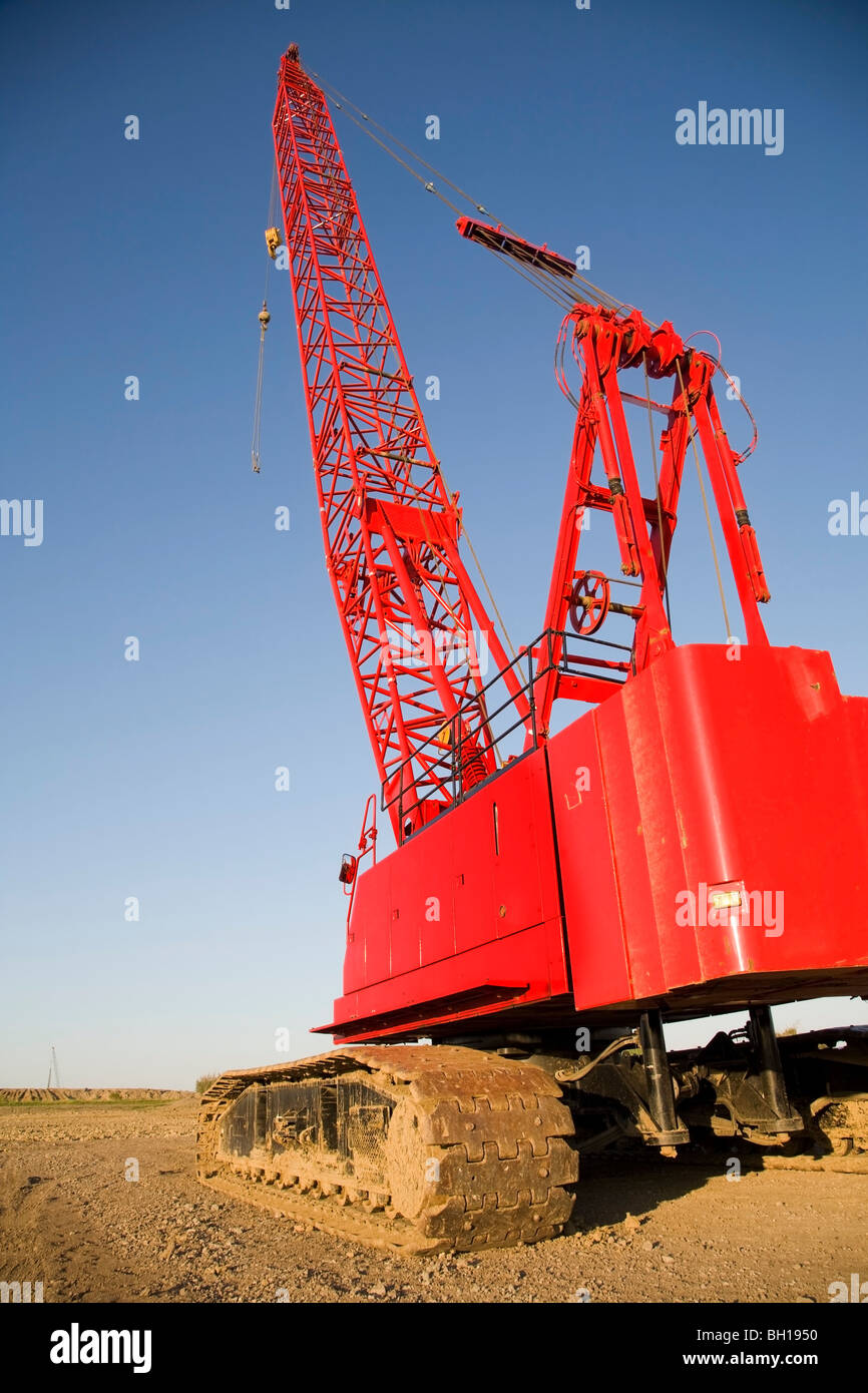 Complete overview of Crane Engine and Power Systems Explained featuring certified crane operator executing lift plan with proper hand signals, ground crew coordination, and safety zone establishment per OSHA regulations