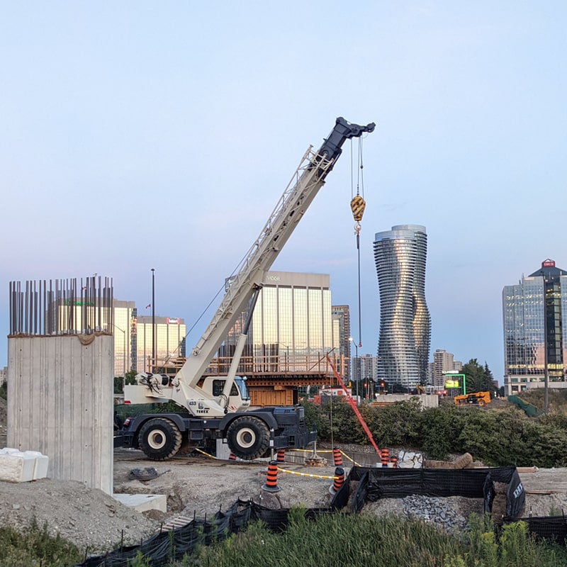 Crane operator performing crane apprenticeship procedures during pre-shift inspection - critical skills tested on NCCCO written and practical exams for LAT and TSS certification