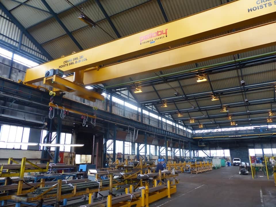 Crane operator performing turntable inspection crane procedures during pre-shift inspection - critical skills tested on NCCCO written and practical exams for LAT and TSS certification