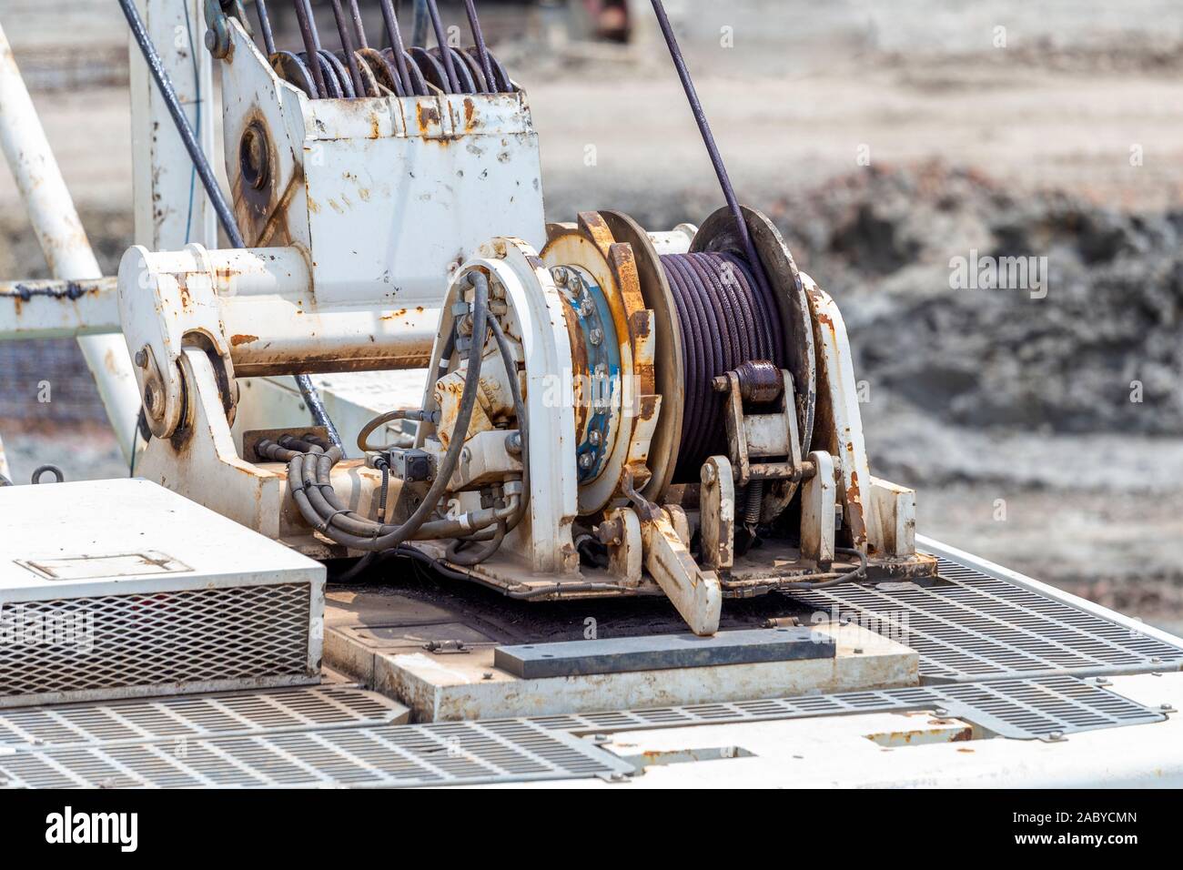 Professional crane operator demonstrating Crane Winch and Drum Operations Guide techniques on an active construction site - essential knowledge for NCCCO certification exam preparation covering crane winch safety protocols and operational procedures