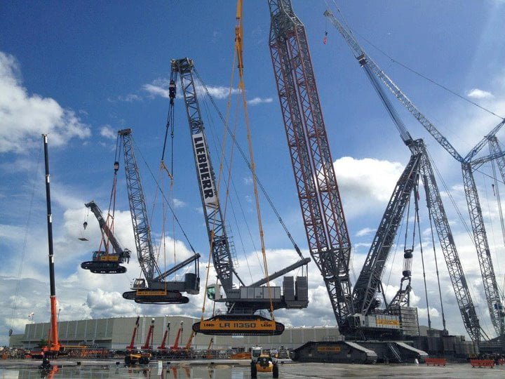 Professional crane operator demonstrating Critical Lift Planning Guide techniques on an active construction site - essential knowledge for NCCCO certification exam preparation covering critical lift safety protocols and operational procedures