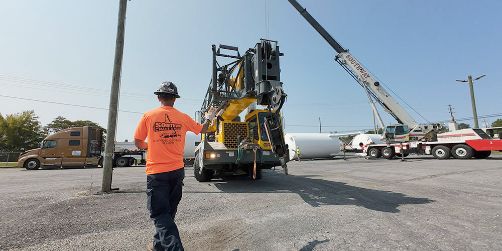 Crane operator performing critical lift procedures during pre-shift inspection - critical skills tested on NCCCO written and practical exams for LAT and TSS certification