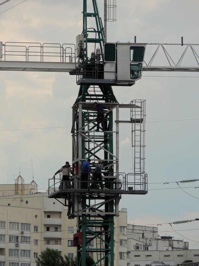 Professional crane operator demonstrating Crane Operations at High Altitude Job Sites techniques on an active construction site - essential knowledge for NCCCO certification exam preparation covering high altitude crane safety protocols and operational procedures