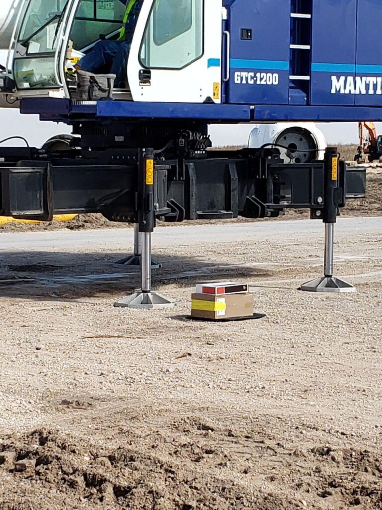 Crane operator performing crane ground conditions procedures during pre-shift inspection - critical skills tested on NCCCO written and practical exams for LAT and TSS certification
