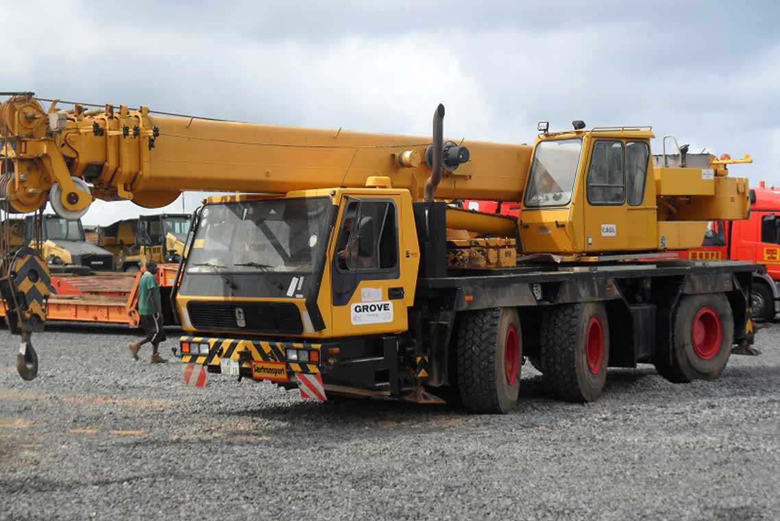 Professional crane operator demonstrating Grove Crane Models Every Operator Should Know techniques on an active construction site - essential knowledge for NCCCO certification exam preparation covering grove crane safety protocols and operational procedures