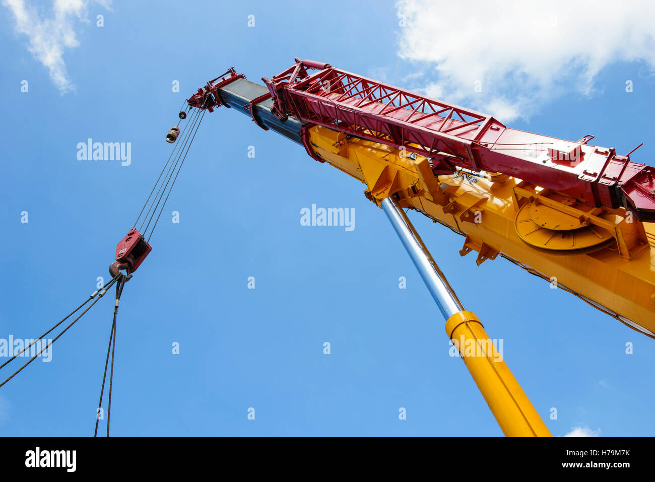 Complete overview of Hydraulic Crane Systems Guide featuring certified crane operator executing lift plan with proper hand signals, ground crew coordination, and safety zone establishment per OSHA regulations