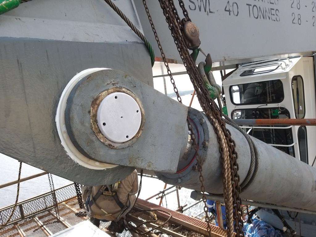 Complete overview of Hydraulic Cylinder Inspection for Crane Operators featuring certified crane operator executing lift plan with proper hand signals, ground crew coordination, and safety zone establishment per OSHA regulations