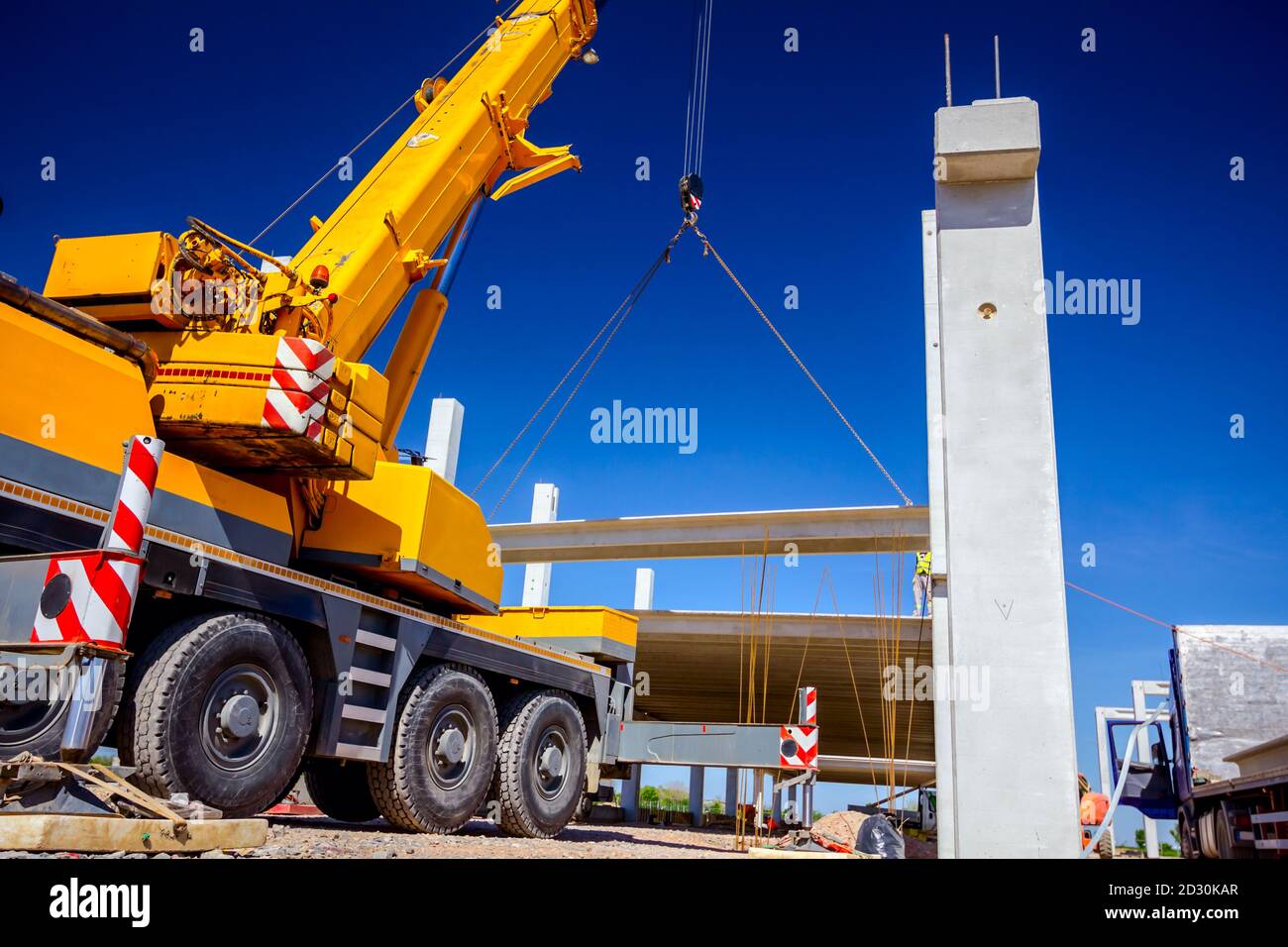 Professional crane operator demonstrating Outrigger Beam and Cylinder Inspection techniques on an active construction site - essential knowledge for NCCCO certification exam preparation covering outrigger inspection safety protocols and operational procedures