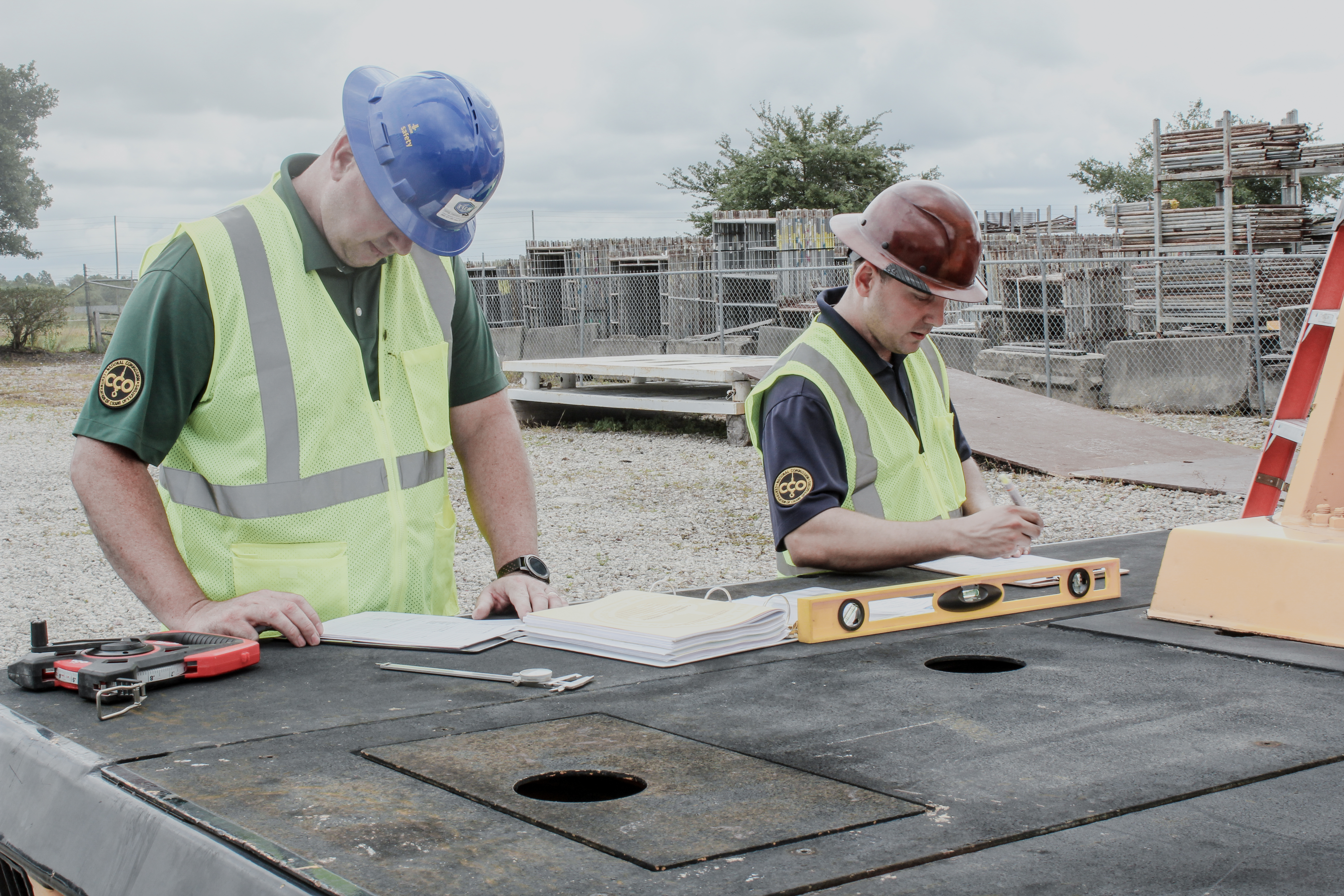 Complete overview of Third Party Crane Inspection Process featuring certified crane operator executing lift plan with proper hand signals, ground crew coordination, and safety zone establishment per OSHA regulations