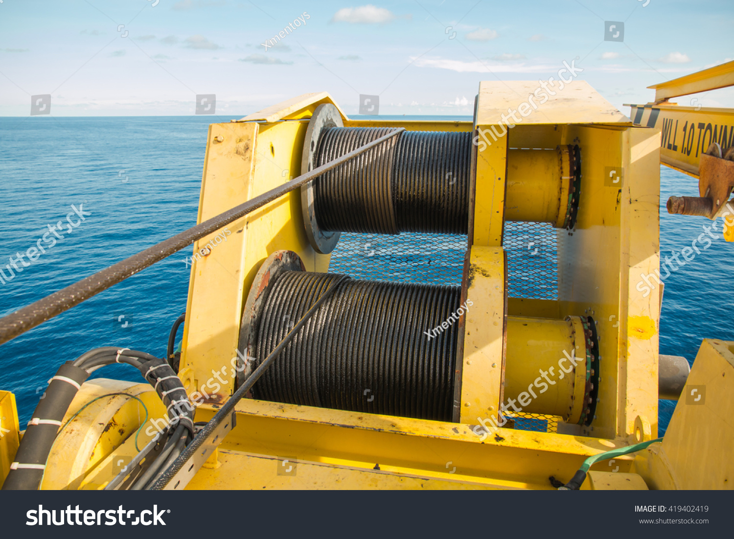 Complete overview of Wire Rope Retirement Criteria Complete Guide featuring certified crane operator executing lift plan with proper hand signals, ground crew coordination, and safety zone establishment per OSHA regulations