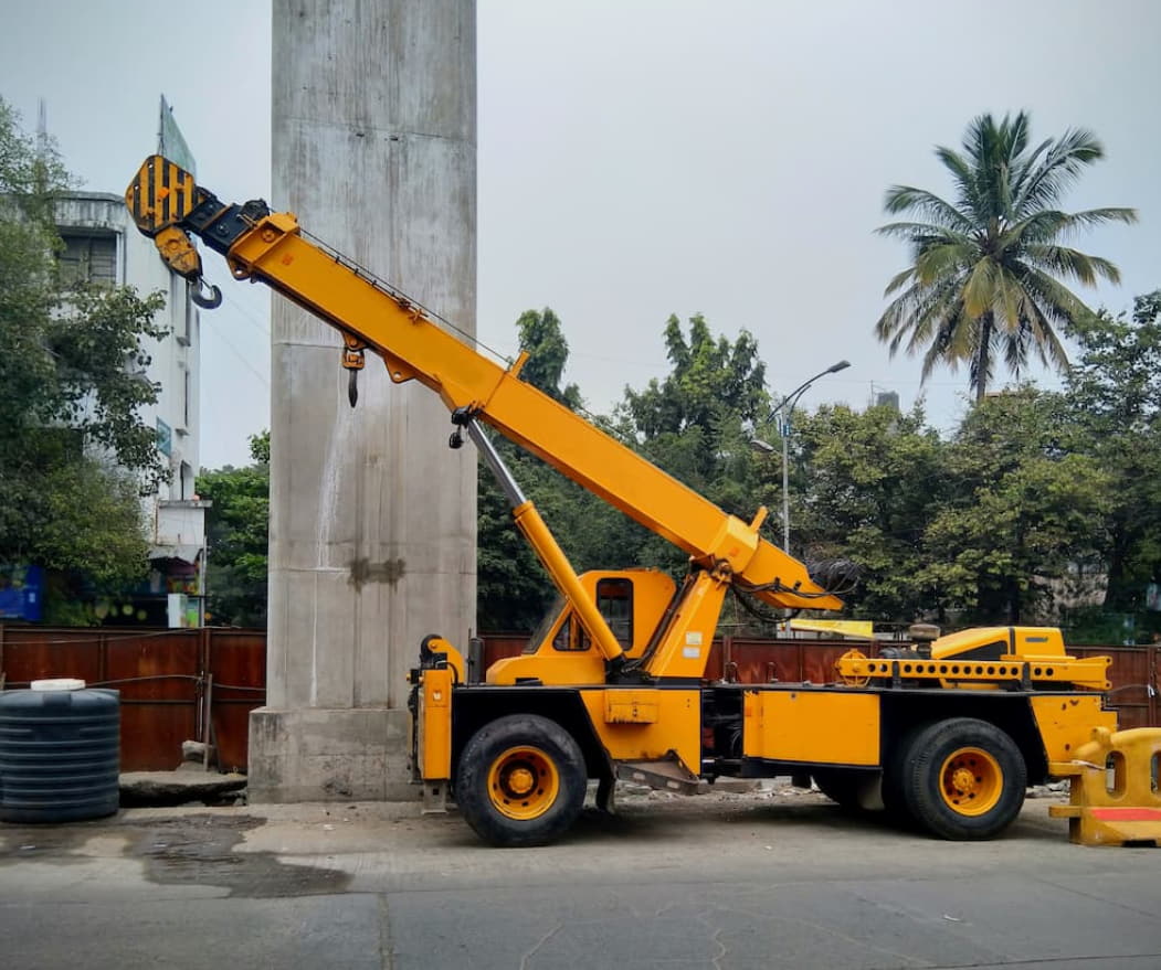 Crane operator performing pick and carry crane procedures during pre-shift inspection - critical skills tested on NCCCO written and practical exams for LAT and TSS certification