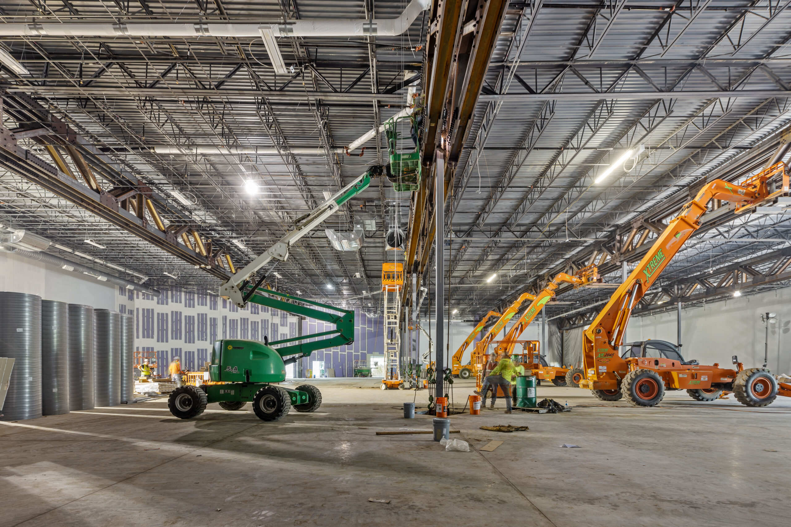 Professional crane operator demonstrating Reading Twin Lift and Tandem Crane Load Charts techniques on an active construction site - essential knowledge for NCCCO certification exam preparation covering twin lift capacity safety protocols and operational procedures