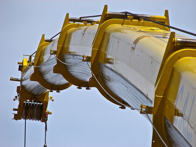 Crane operator performing boom deflection crane procedures during pre-shift inspection - critical skills tested on NCCCO written and practical exams for LAT and TSS certification