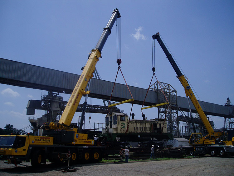 Step-by-step demonstration of Multi-Crane Lift Procedures showing load chart interpretation, boom angle calculations, and outrigger positioning per NCCCO certification requirements and ASME standards