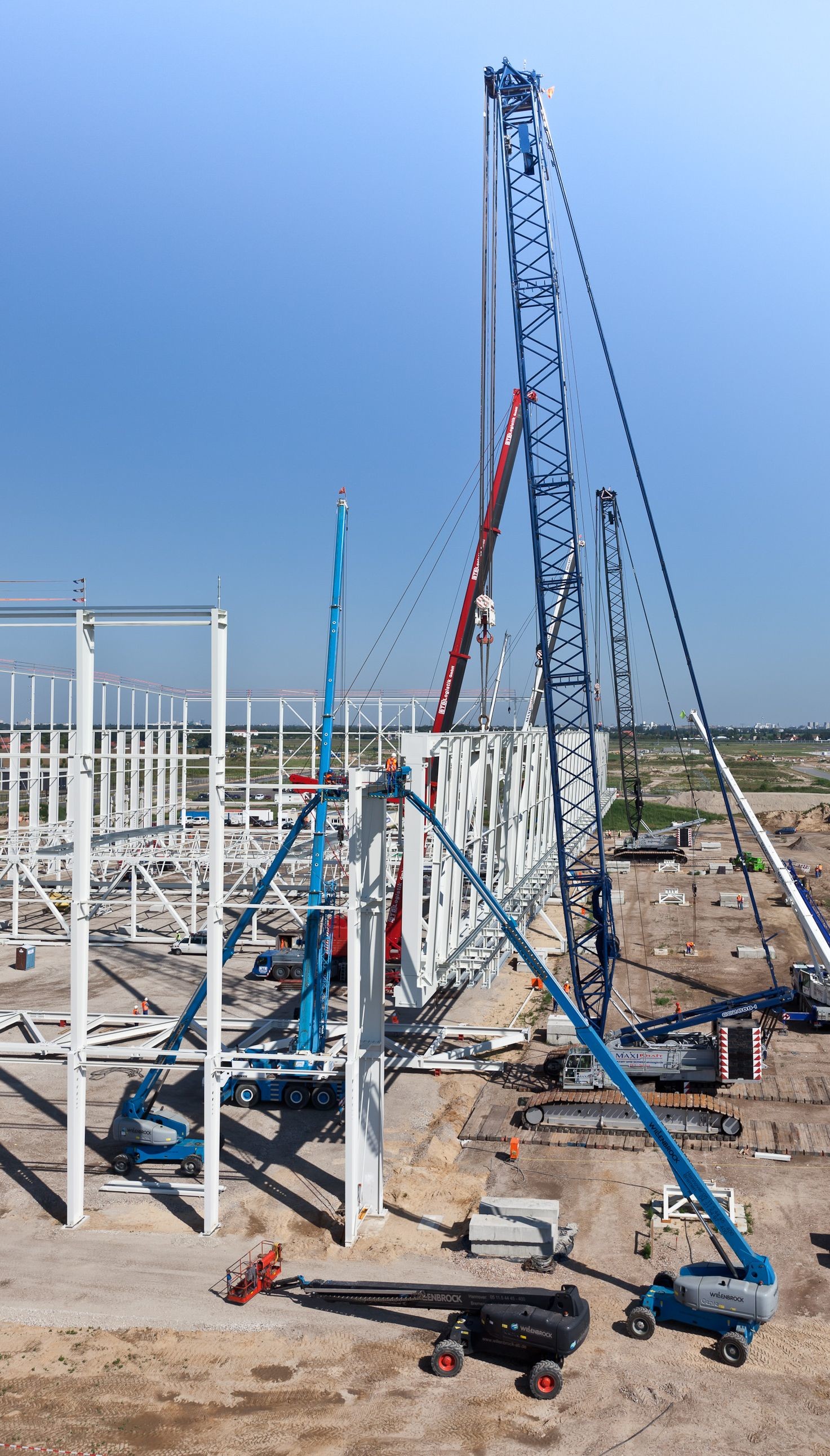 Crane operator performing multi crane lift procedures during pre-shift inspection - critical skills tested on NCCCO written and practical exams for LAT and TSS certification