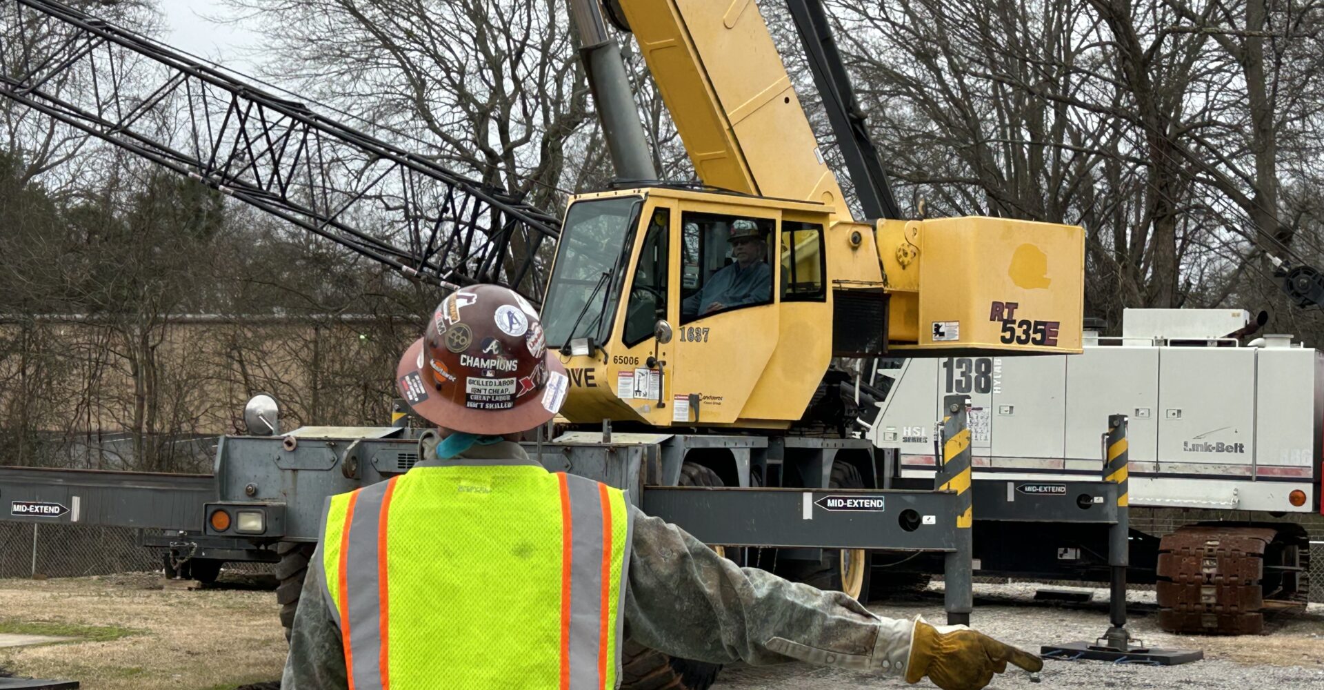 Professional crane operator demonstrating NCCCO Signalperson Certification Guide techniques on an active construction site - essential knowledge for NCCCO certification exam preparation covering signalperson certification safety protocols and operational procedures