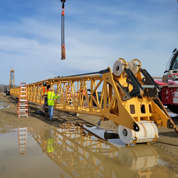 Detailed view of OSHA Assembly Disassembly Director Requirements implementation showing proper crane setup and rigging configuration as required by OSHA 29 CFR 1926 regulations and ASME B30.5 standards for certified operators