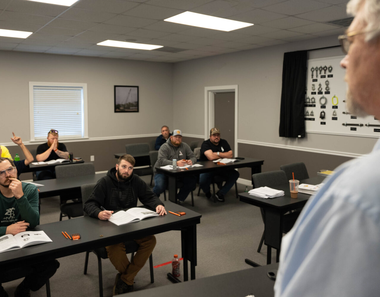 Complete overview of OSHA Pre-Operation Site Assessment Requirements featuring certified crane operator executing lift plan with proper hand signals, ground crew coordination, and safety zone establishment per OSHA regulations