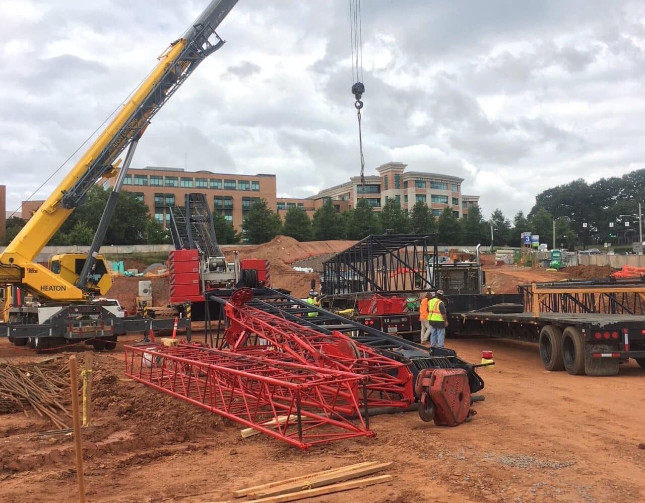 Step-by-step demonstration of OSHA Pre-Operation Site Assessment Requirements showing load chart interpretation, boom angle calculations, and outrigger positioning per NCCCO certification requirements and ASME standards