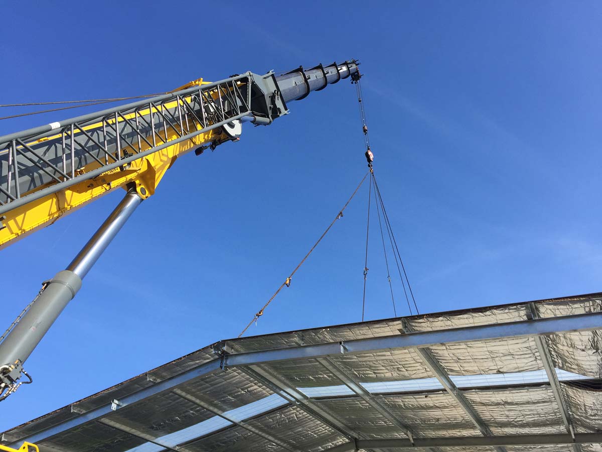 Step-by-step demonstration of OSHA Multi-Employer Worksite Crane Rules showing load chart interpretation, boom angle calculations, and outrigger positioning per NCCCO certification requirements and ASME standards