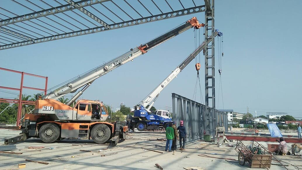 Crane operator performing rough terrain crane procedures during pre-shift inspection - critical skills tested on NCCCO written and practical exams for LAT and TSS certification