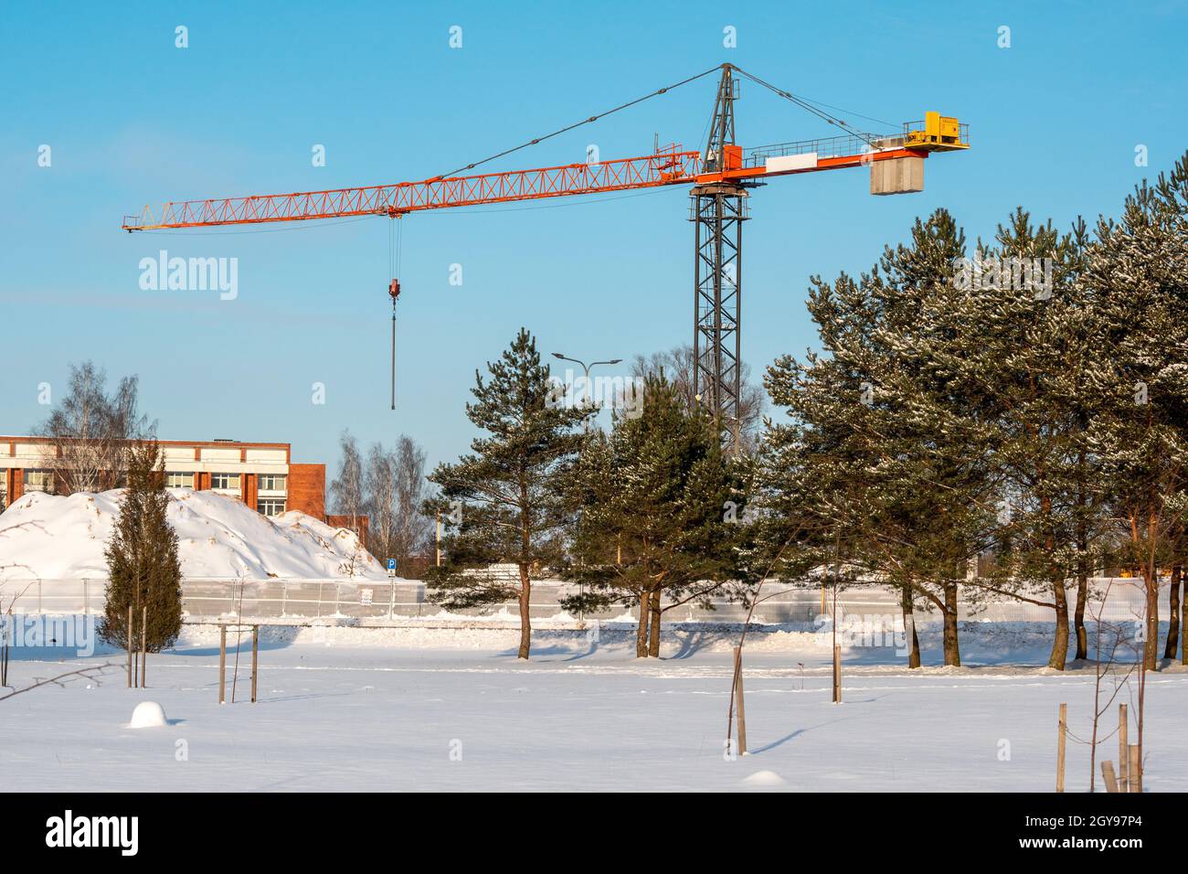 Detailed view of Cold Weather Crane Operation Safety implementation showing proper crane setup and rigging configuration as required by OSHA 29 CFR 1926 regulations and ASME B30.5 standards for certified operators