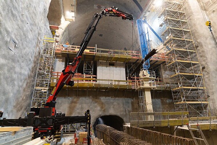 Detailed view of Crane Operations Supporting Confined Space Work implementation showing proper crane setup and rigging configuration as required by OSHA 29 CFR 1926 regulations and ASME B30.5 standards for certified operators