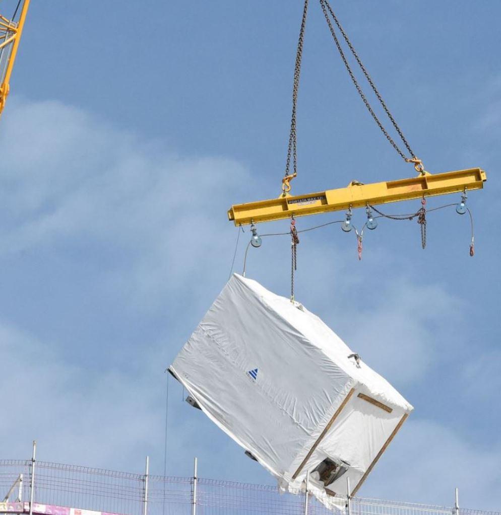 Professional crane operator demonstrating Dropped Load Prevention Strategies techniques on an active construction site - essential knowledge for NCCCO certification exam preparation covering dropped load crane safety protocols and operational procedures