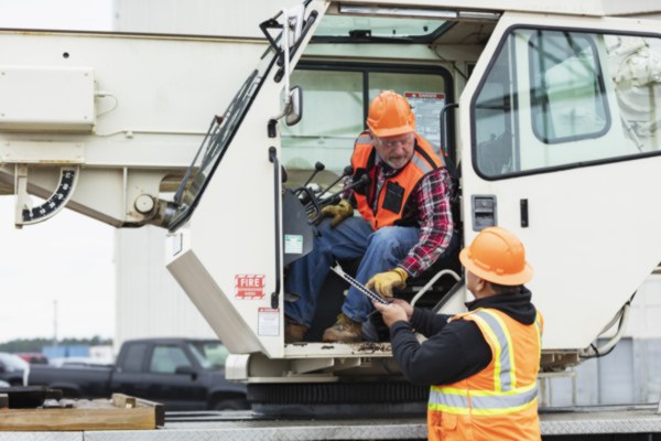 Crane operator performing operator fatigue crane procedures during pre-shift inspection - critical skills tested on NCCCO written and practical exams for LAT and TSS certification