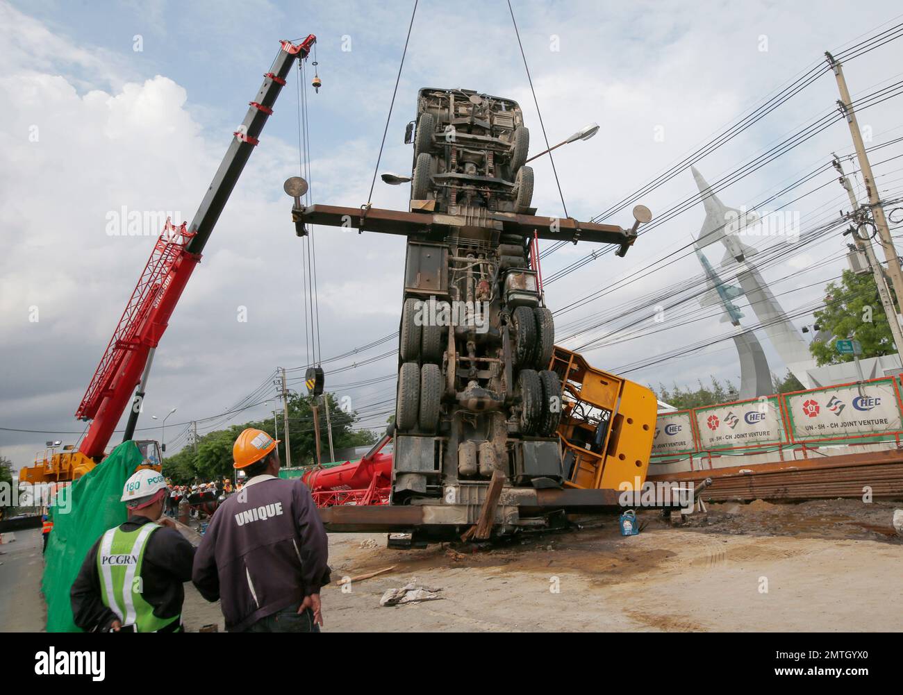 Complete overview of Crane Tip Over Prevention and Warning Signs featuring certified crane operator executing lift plan with proper hand signals, ground crew coordination, and safety zone establishment per OSHA regulations