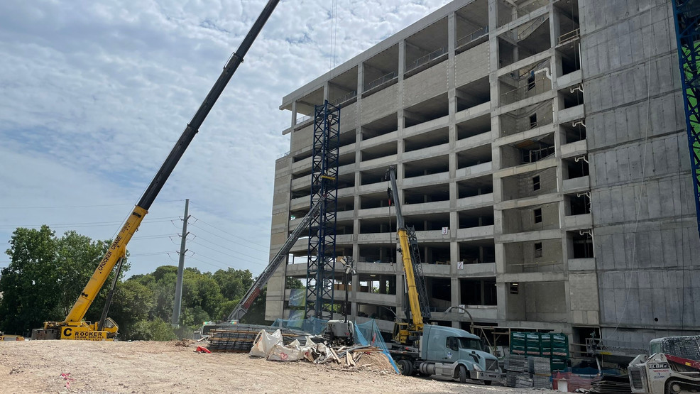 Professional crane operator demonstrating Heat Illness Prevention for Crane Operators techniques on an active construction site - essential knowledge for NCCCO certification exam preparation covering heat illness crane operator safety protocols and operational procedures