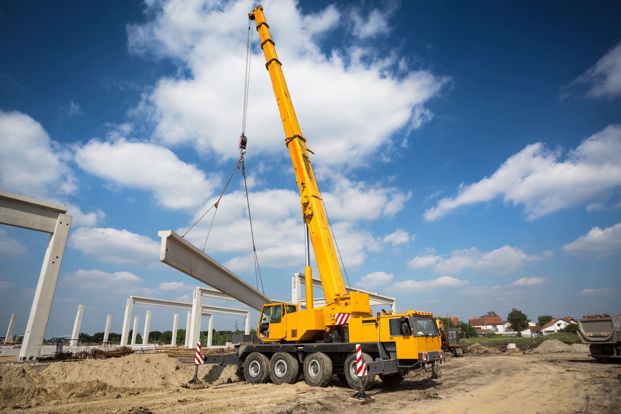 Crane operator performing crane telematics procedures during pre-shift inspection - critical skills tested on NCCCO written and practical exams for LAT and TSS certification