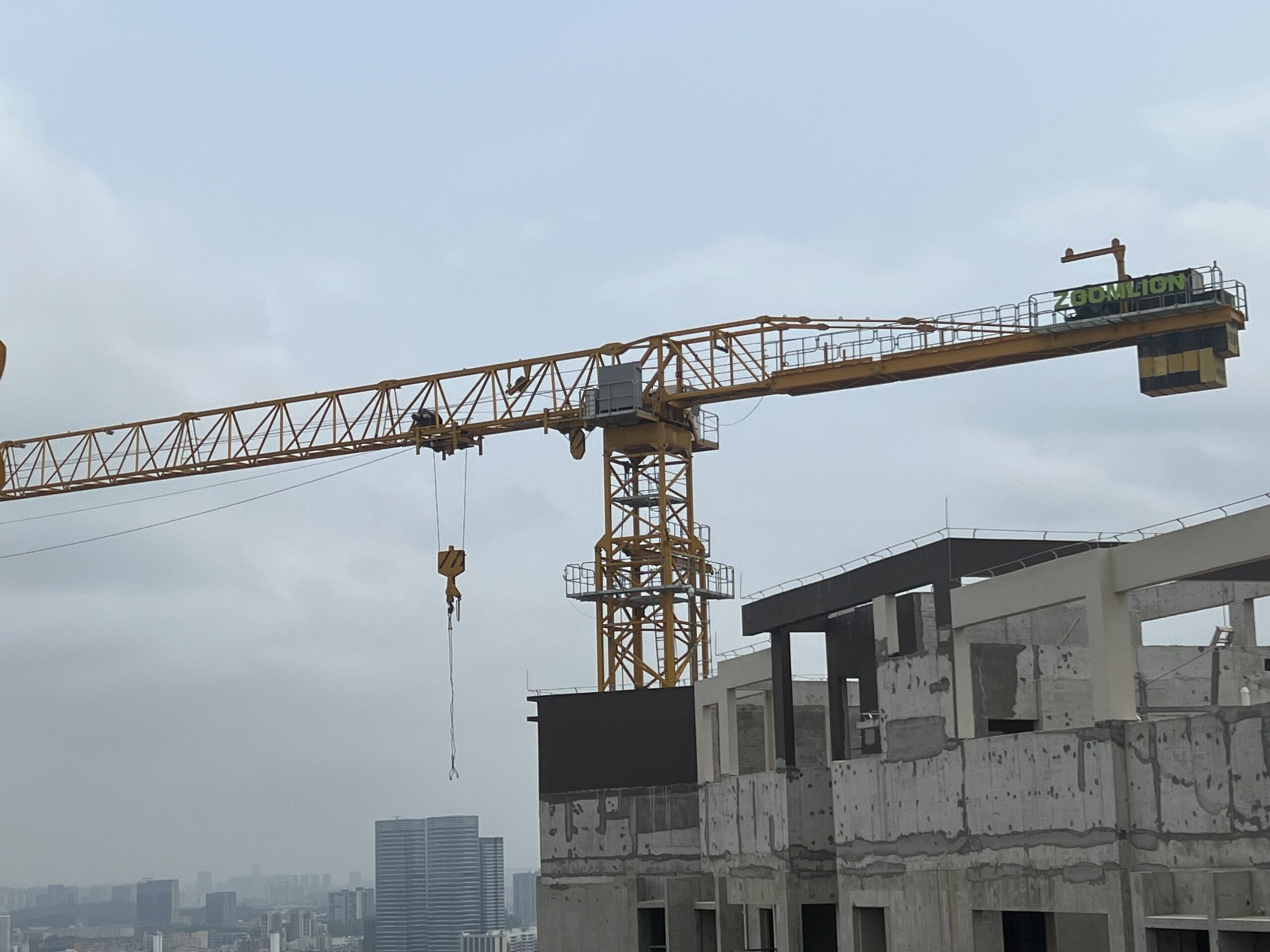 Professional crane operator demonstrating Tower Crane Types and Configurations techniques on an active construction site - essential knowledge for NCCCO certification exam preparation covering tower crane types safety protocols and operational procedures
