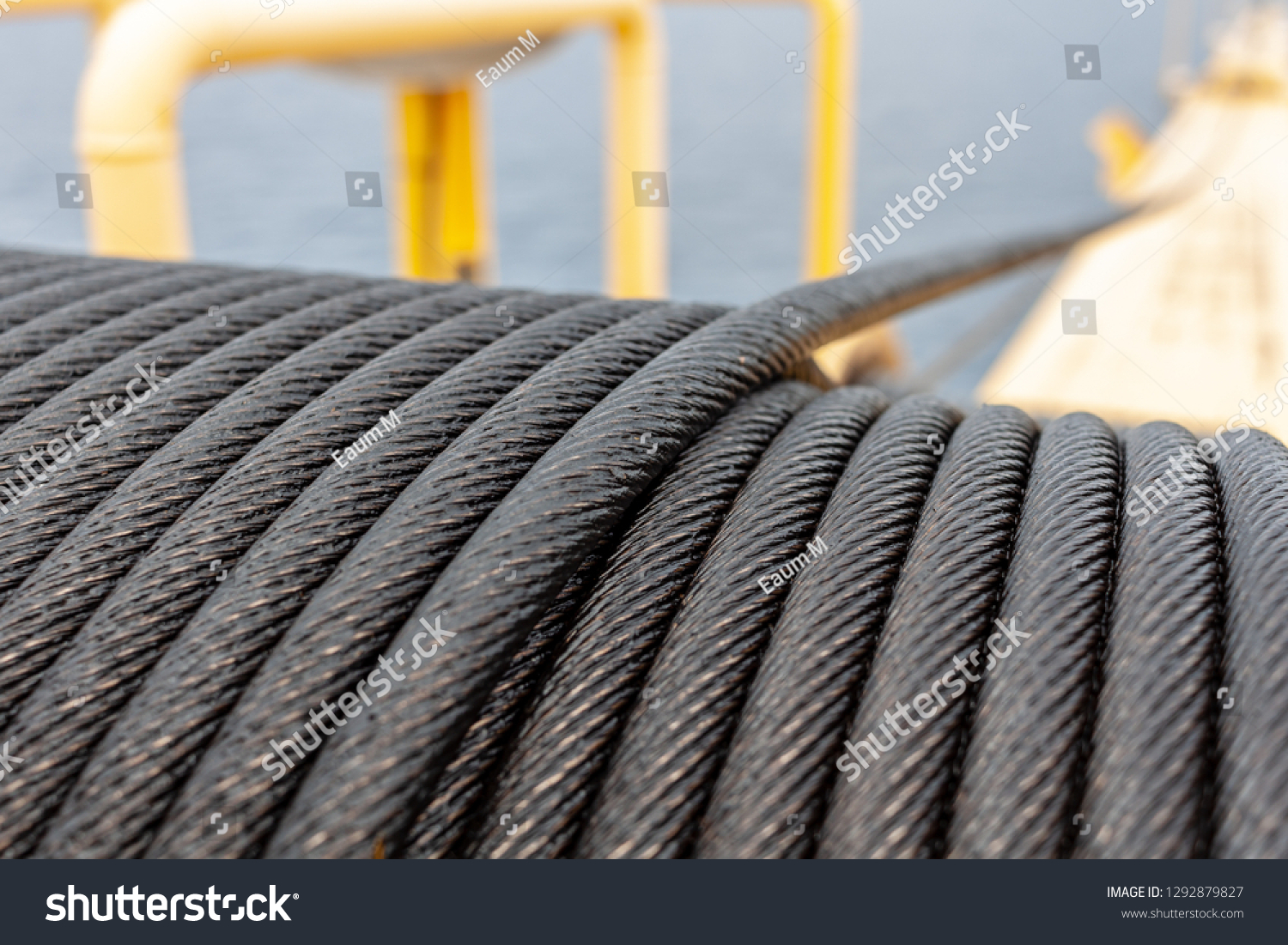 Complete overview of Wire Rope Sling Capacity Charts featuring certified crane operator executing lift plan with proper hand signals, ground crew coordination, and safety zone establishment per OSHA regulations